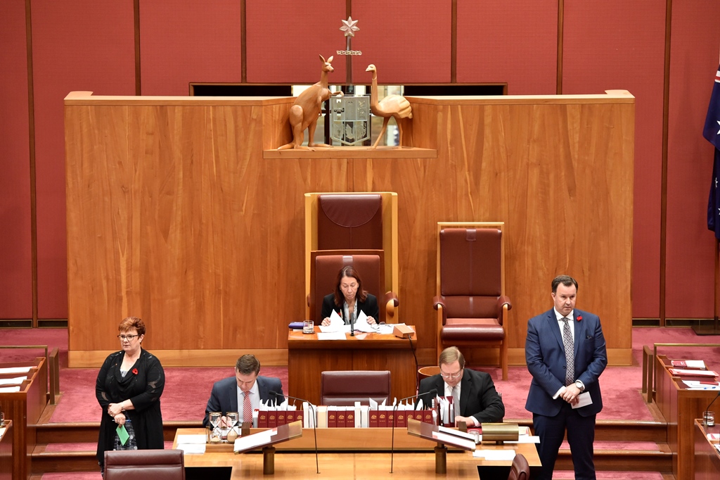 Party whips counting the votes in a division in the Senate.